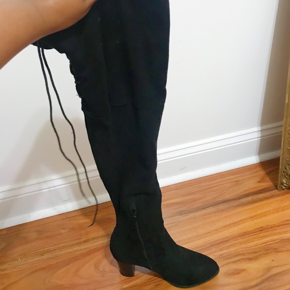 QPid, black over the know boots.